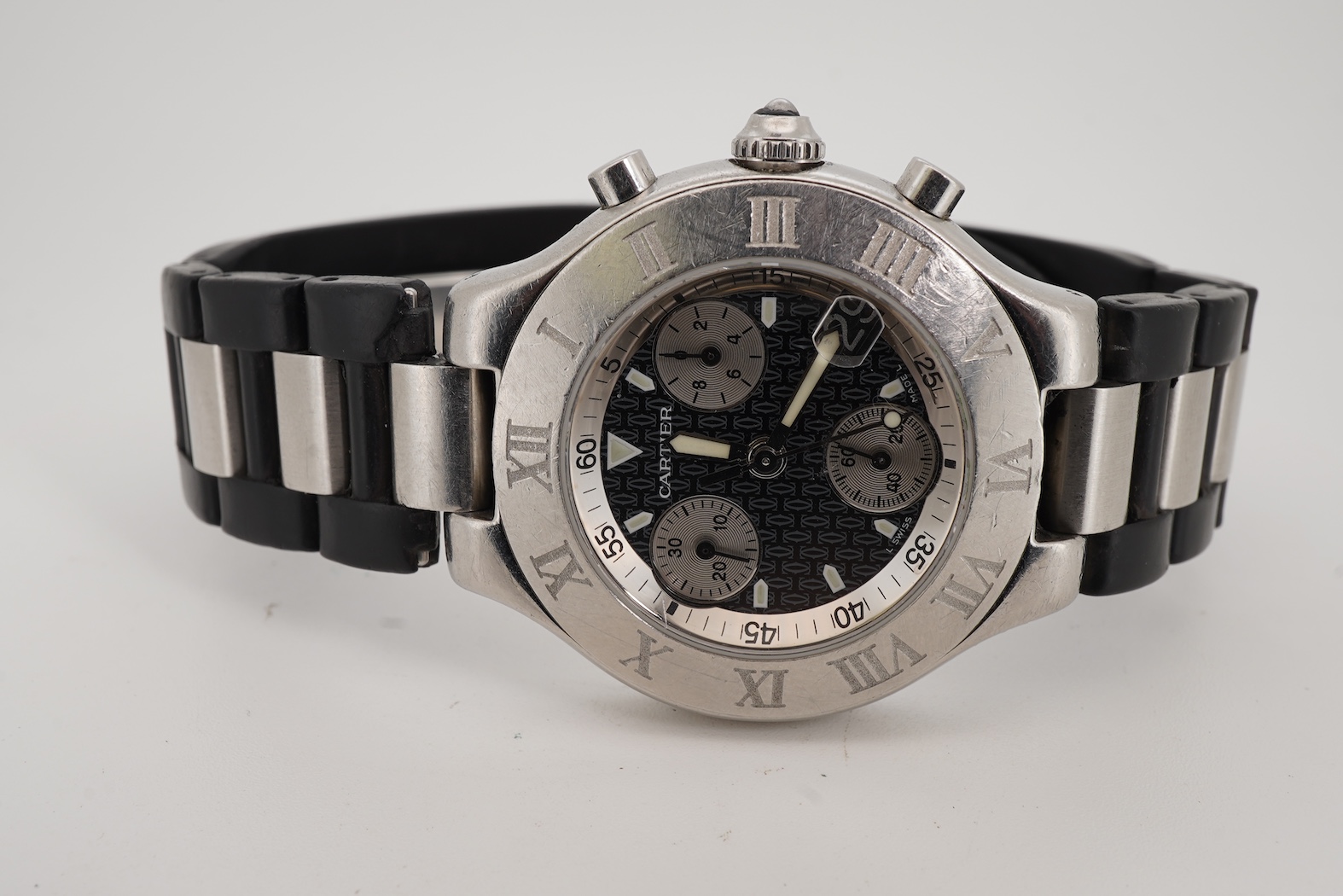 A gentleman's stainless steel Cartier 21 Chronoscaph wrist watch, the black face with three subsidiary dials, date aperture and baton numerals